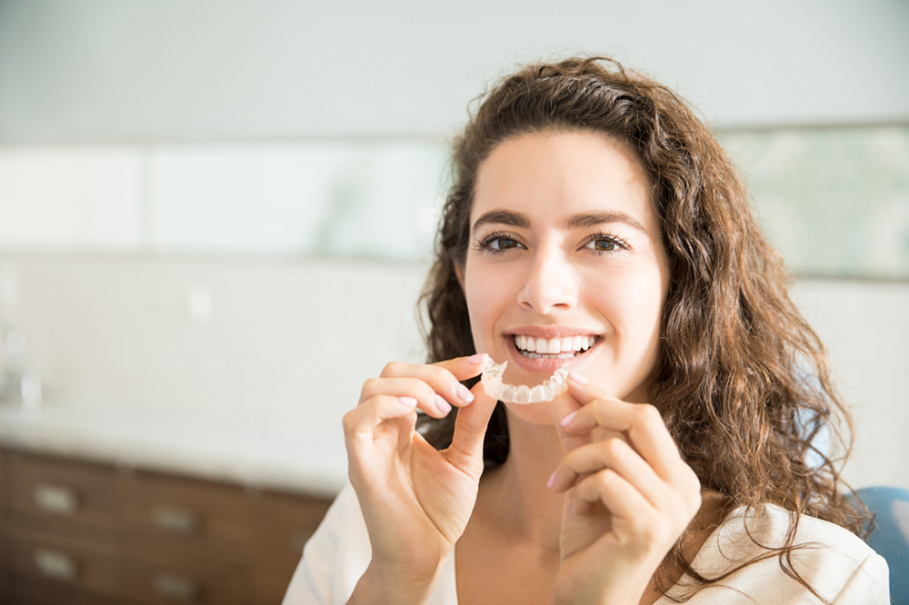 woman wearing Invisalign